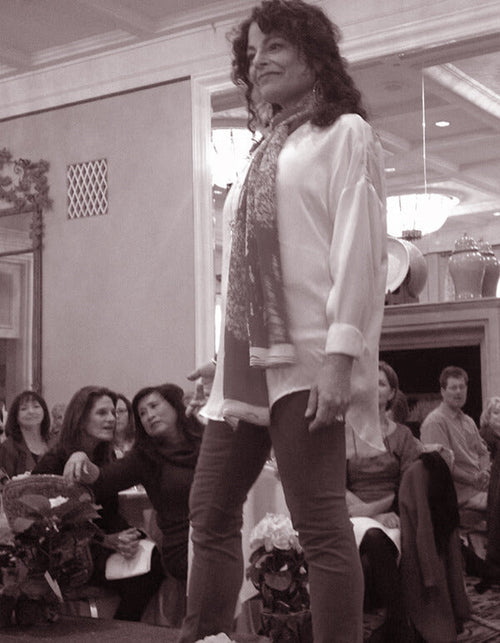 Gayle Brinkenhoff walks the “survivors” runway at the Breast Cancer Resource Center