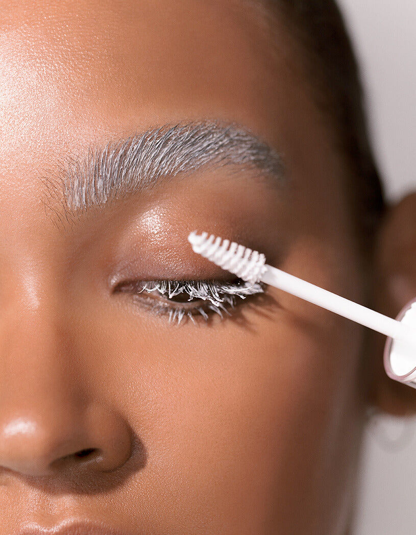 model applying lash & brow masque